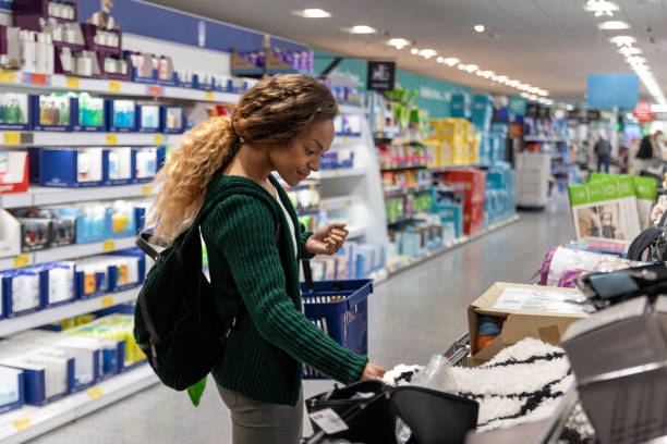 Mid-adult woman shopping on a budget. She is looking for home accesories and appliances as a treat. She is living in the North East of England.